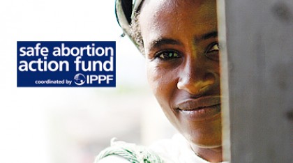 Safe Abortion Action Fund logo and a woman