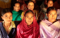 A group of young Bangladeshi girls sit together
