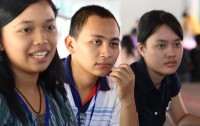 Two girls and a boy sit together